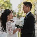 side-view-bride-groom-posing-street_23-2148746628